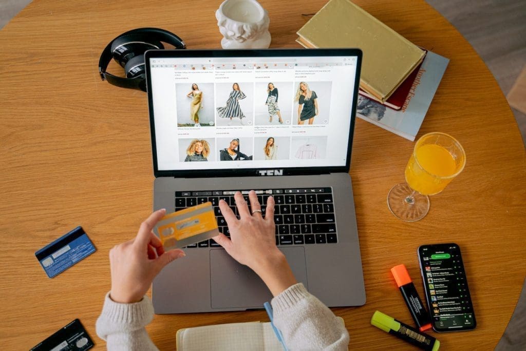 paying for online shopping at laptop